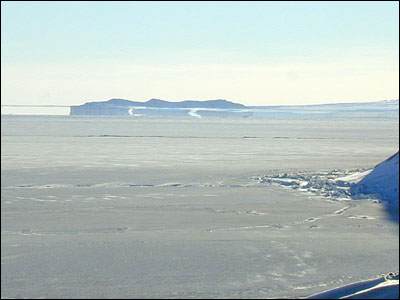 The part of the photo between the sea ice and the 
												 horizontal line above it is a Fata Morgana. The actual 
												 horizon is the upper line.