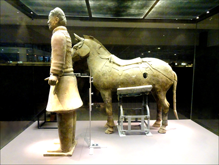 Warrior with a Saddle Horse