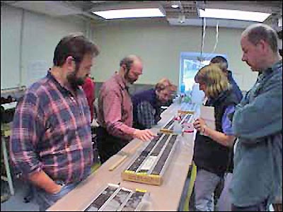 Scientists examining core