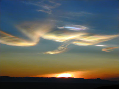 Sunset over McMurdo Sound. The little blue & pink cloud 
                            is a nacreous one.