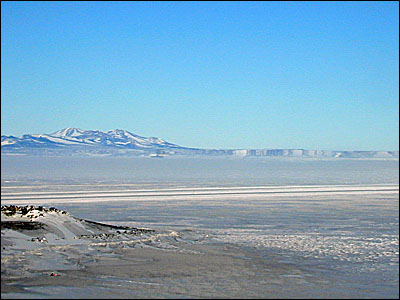Fata Morgana beyond the runway. The flat mountains 
												 on the right side of the picture aren't really there. 
												 They are a mirage - a Fata Morgana