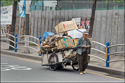 Man pulling cardboard